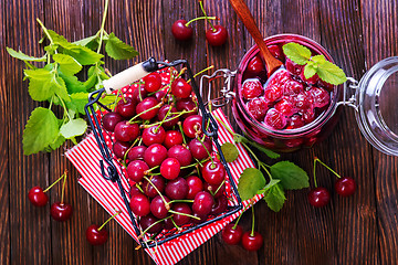 Image showing cherry jam and berries