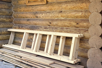 Image showing Wooden stairs and timber house wall.