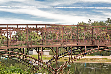 Image showing Metal bridge over a small river.