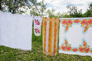 Image showing In the garden on a rope dried laundered linen.