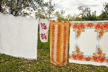 Image showing In the garden on a rope dried laundered linen.