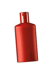 Image showing red cosmetic bottle isolated on the white