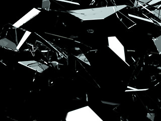 Image showing Pieces of splitted or cracked glass on black