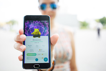 Image showing Moscow, Russia - August, 02: Android user play in Pokemon Go augmented reality mobile game on smartphone.