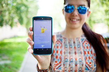 Image showing Moscow, Russia - August, 02: Android user play in Pokemon Go augmented reality mobile game on smartphone.