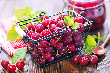 Image showing cherry jam and berries