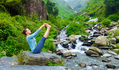 Image showing Woman doing Ashtanga Vinyasa Yoga asana outdoors