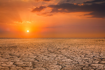 Image showing Cracked earth soil sunset landscape