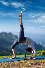 Image showing Woman doing yoga asana outdoors