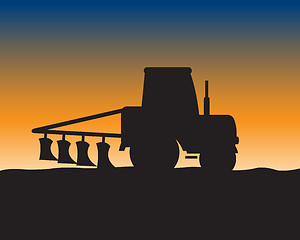 Image showing Silhouette of the tractor in field