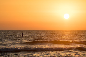 Image showing Man paddleboarding