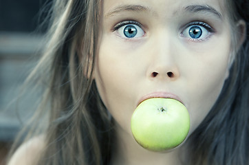 Image showing Little Girl With Green Apple