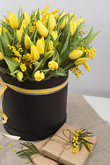 Image showing Bright spring bouquet of tulips and mimosa flowers