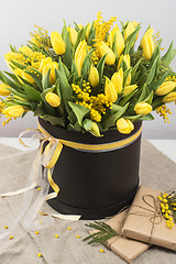 Image showing Bright spring bouquet of tulips and mimosa flowers