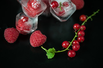 Image showing Frozen berries on wooden table