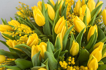 Image showing Bright spring bouquet of tulips and mimosa flowers