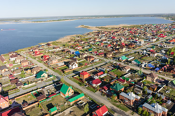 Image showing Aerial view onto private houses on bank of lake