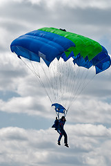 Image showing Paratrooper woman descends