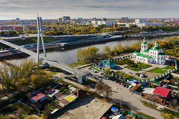 Image showing Pedestrian Lovers Bridge and church. Tyumen.Russia