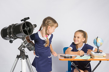 Image showing The two girls looked at each other in the classroom Astronomy