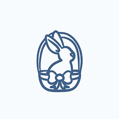 Image showing Easter bunny sitting in basket sketch icon.