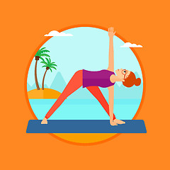 Image showing Woman practicing yoga triangle pose on the beach.
