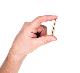 Image showing hand holding bullet