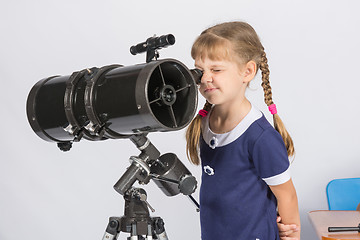 Image showing Girl amateur astronomer watching the stars through a telescope