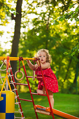 Image showing The little baby girl playing at outdoor playground