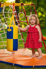 Image showing The little baby girl playing at outdoor playground