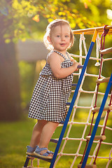 Image showing The little baby girl playing at outdoor playground