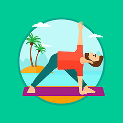 Image showing Man practicing yoga triangle pose on the beach.