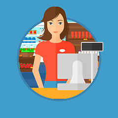 Image showing Cashier standing at the checkout in supermarket.