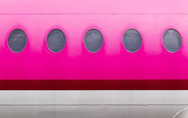 Image showing Windows of the pink airplane