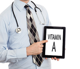 Image showing Doctor holding tablet - Vitamin A