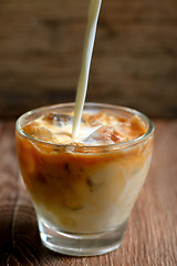 Image showing Iced coffee on wooden table