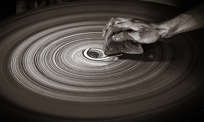 Image showing Man\'s hand on a potter\'s wheel