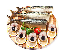 Image showing sliced herring on wooden plate