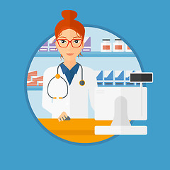 Image showing Pharmacist at counter with computer monitor.