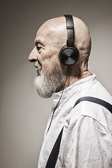 Image showing elderly bald head man with headphones