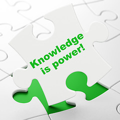 Image showing Studying concept: Knowledge Is power! on puzzle background