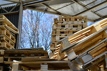 Image showing Waste wood from pallets stacked in the storage room