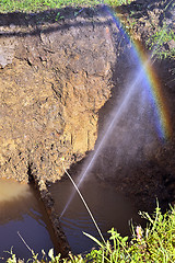 Image showing The water jet in the form of leakage in the damaged metal pipe at the production site