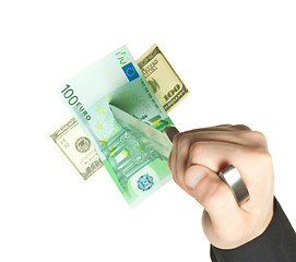 Image showing man knifed euro and dollar isolated