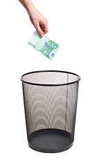 Image showing hand gold euro to trash can