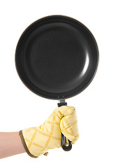 Image showing hand in gloves holding pan