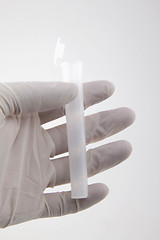 Image showing Hand holding medical tube