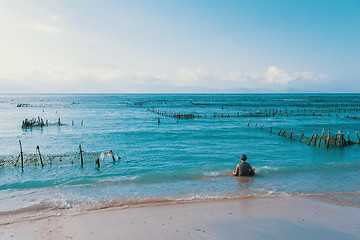 Image showing Dream beach, Algae at low tide and boy