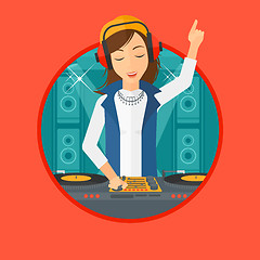 Image showing Smiling DJ mixing music on turntables.