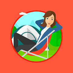 Image showing Woman sitting in folding chair in the camp.